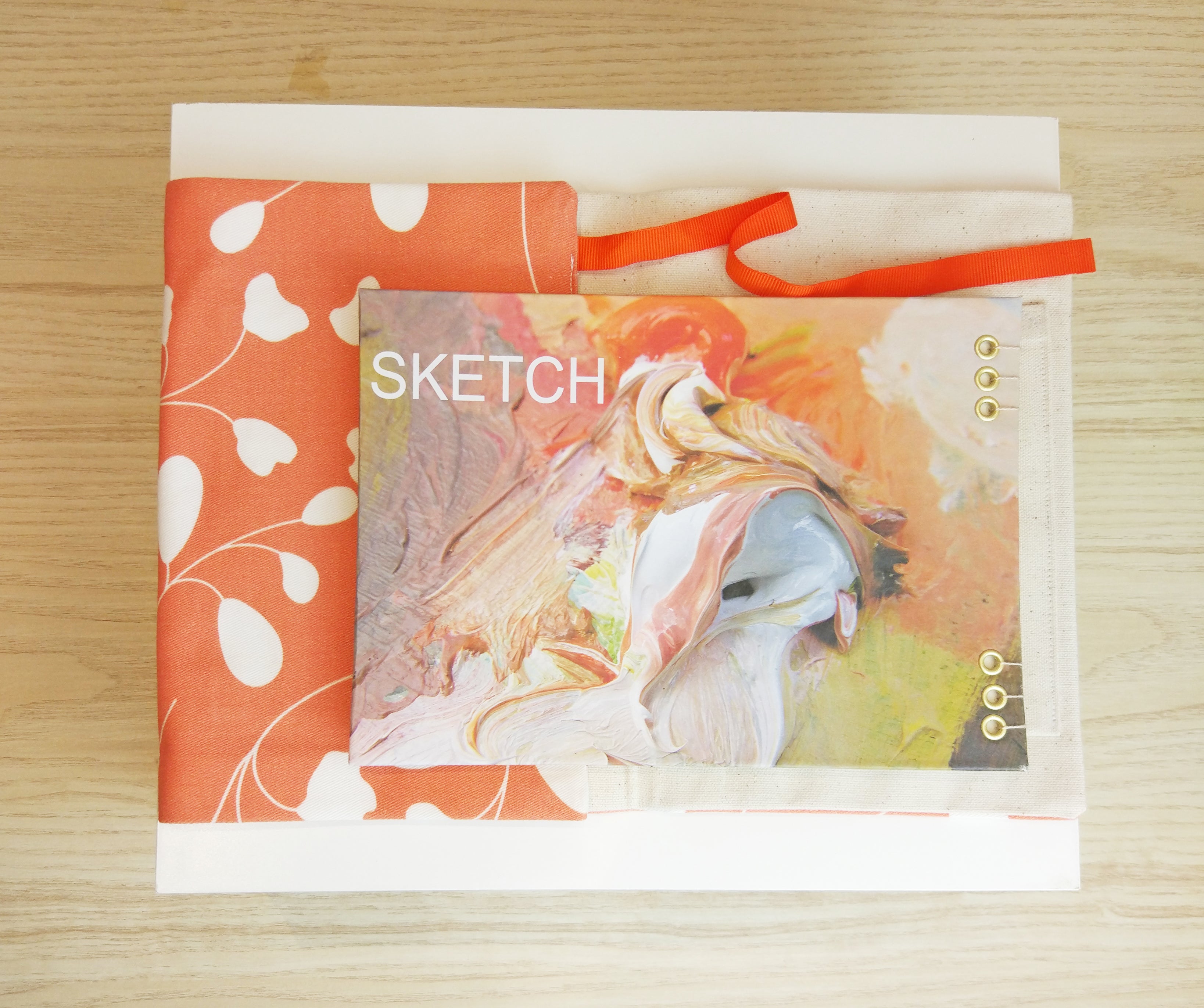 Artist's sketch book and equipment roll